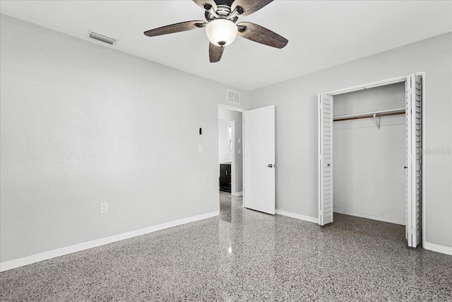 unfurnished bedroom with speckled floor, baseboards, and visible vents