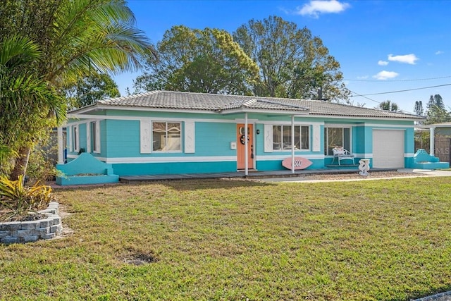 single story home with a garage, a tile roof, and a front yard