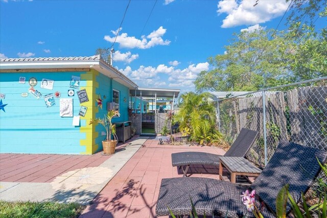 view of patio featuring fence