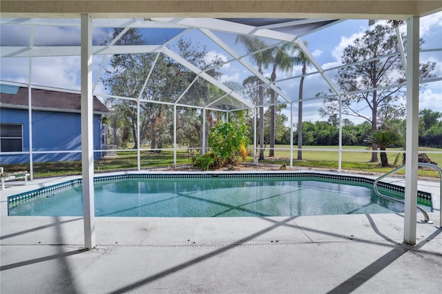 view of swimming pool featuring a patio area and a lanai