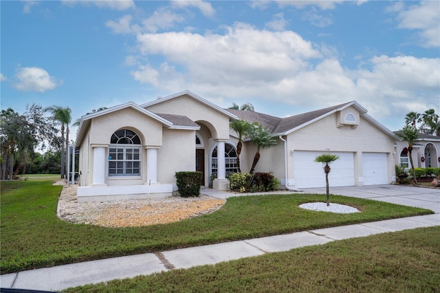 ranch-style home featuring a garage and a front lawn