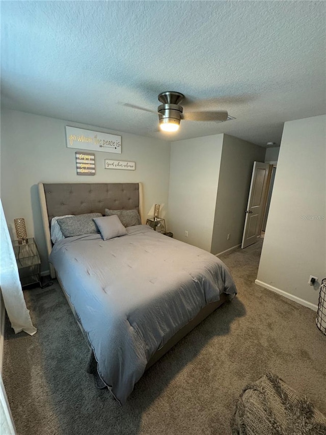 carpeted bedroom with ceiling fan and a textured ceiling