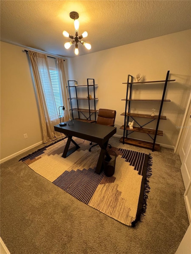 interior space featuring a chandelier, a textured ceiling, and carpet floors