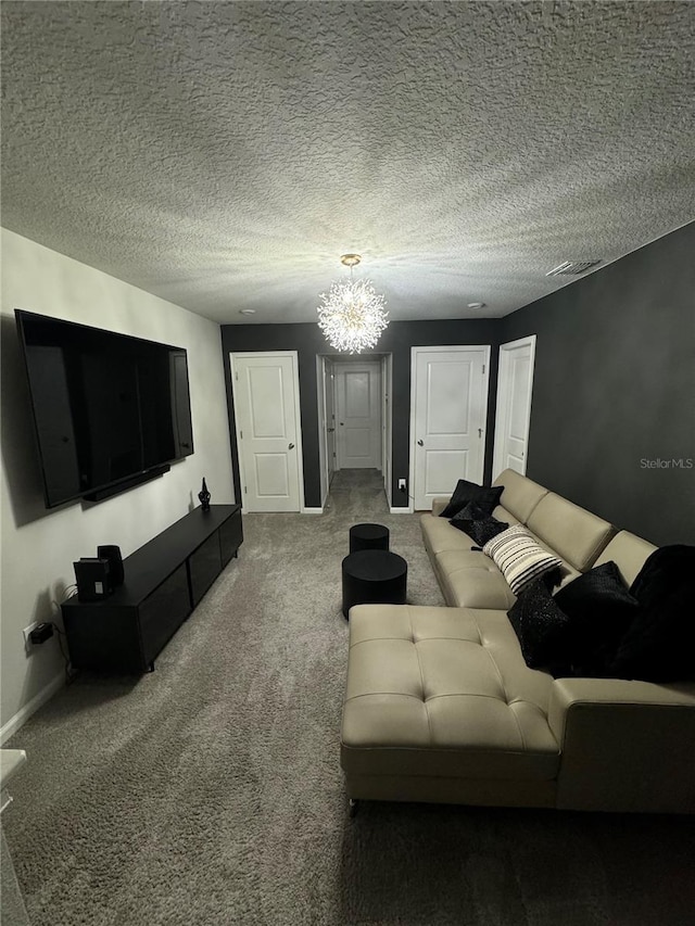 carpeted living room with a chandelier and a textured ceiling