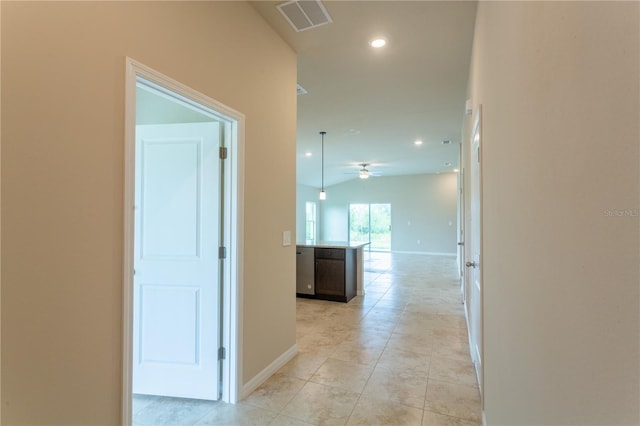 corridor featuring light tile patterned floors