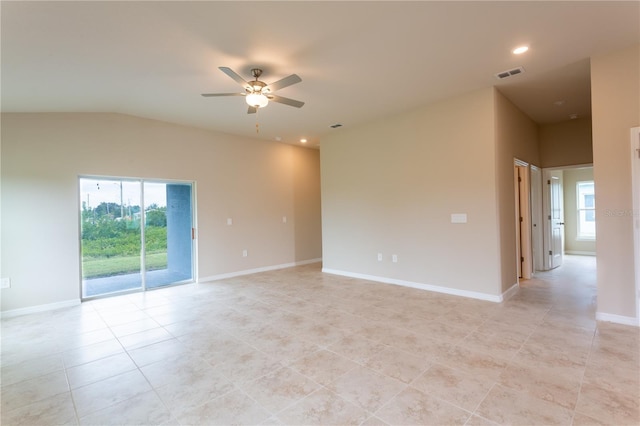 spare room featuring light tile patterned floors, ceiling fan, and lofted ceiling