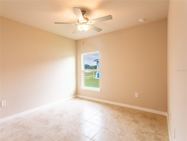 unfurnished room featuring ceiling fan and light tile patterned flooring