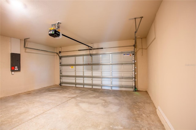 garage featuring electric panel and a garage door opener