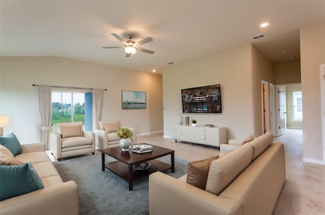 living room featuring ceiling fan and lofted ceiling