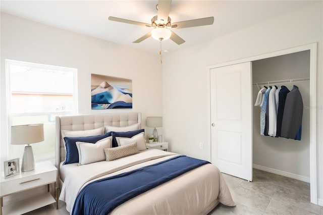 bedroom featuring ceiling fan, a closet, and light tile patterned floors