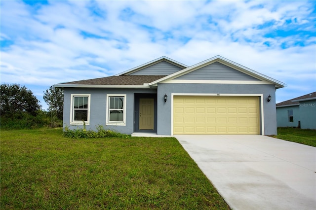 view of front of home with a garage and a front lawn