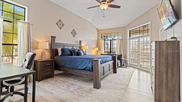 bedroom with access to exterior, light wood-type flooring, multiple windows, and ceiling fan