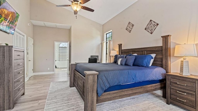 bedroom featuring ceiling fan, high vaulted ceiling, and light hardwood / wood-style floors