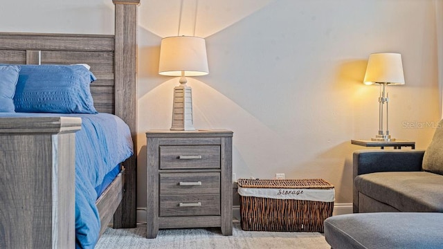 bedroom with light colored carpet and vaulted ceiling