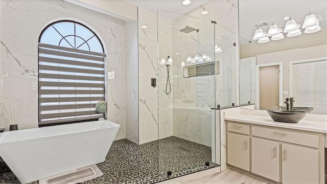 bathroom with plus walk in shower and vanity