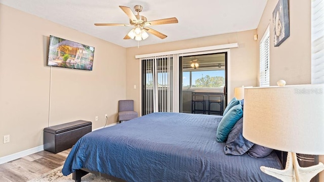 bedroom featuring access to exterior, ceiling fan, and light hardwood / wood-style flooring