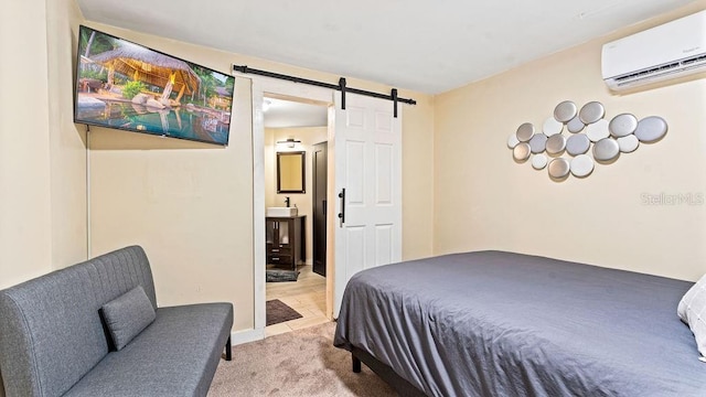 bedroom featuring connected bathroom, sink, a barn door, an AC wall unit, and light carpet