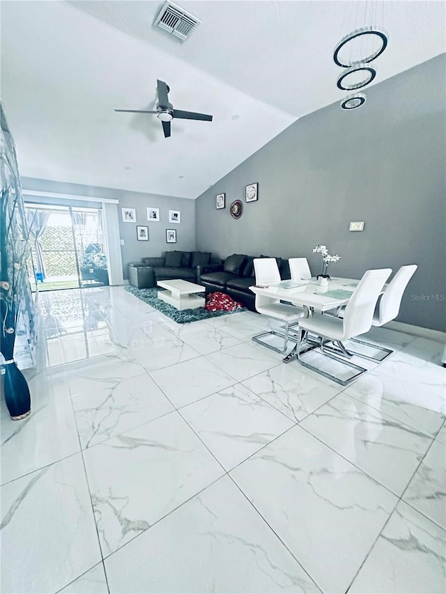 living room with ceiling fan and vaulted ceiling