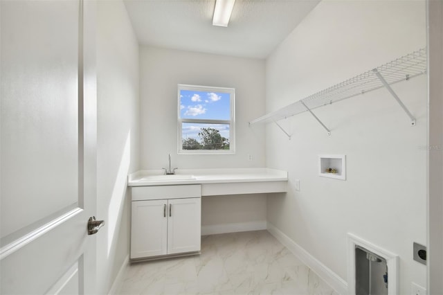 laundry area featuring cabinets, electric dryer hookup, sink, and washer hookup