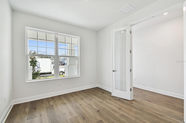 spare room featuring hardwood / wood-style floors