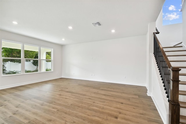 unfurnished living room with light hardwood / wood-style flooring