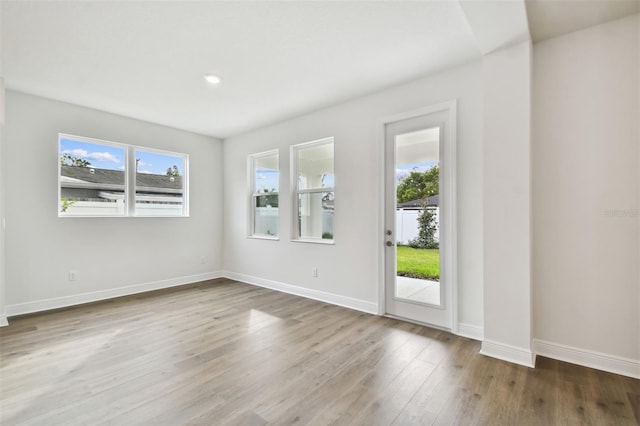 spare room with hardwood / wood-style flooring