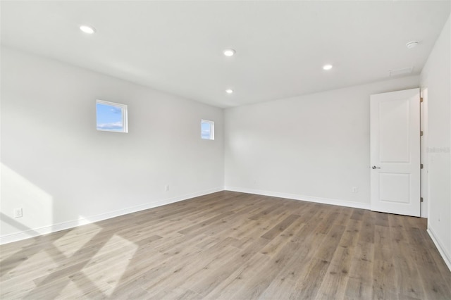 spare room with light wood-type flooring