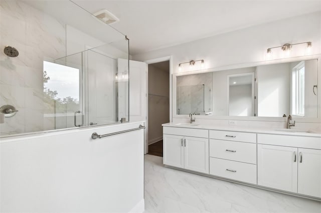 bathroom with vanity and walk in shower