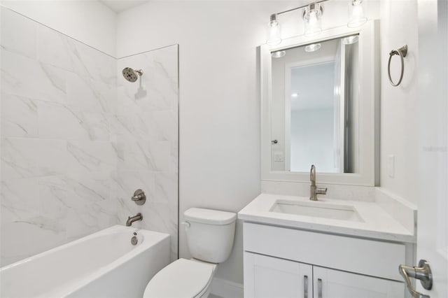 full bathroom with vanity, toilet, and tiled shower / bath