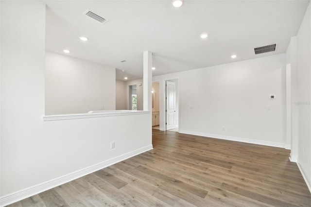 spare room featuring hardwood / wood-style flooring