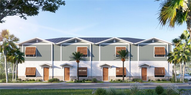 13750 Park Blvd Unit 4, Seminole, FL 33776 - view of front facade with stone siding and metal roof