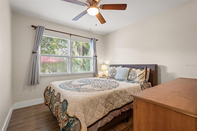 bedroom featuring ceiling fan and dark hardwood / wood-style floors