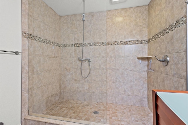 bathroom with tiled shower