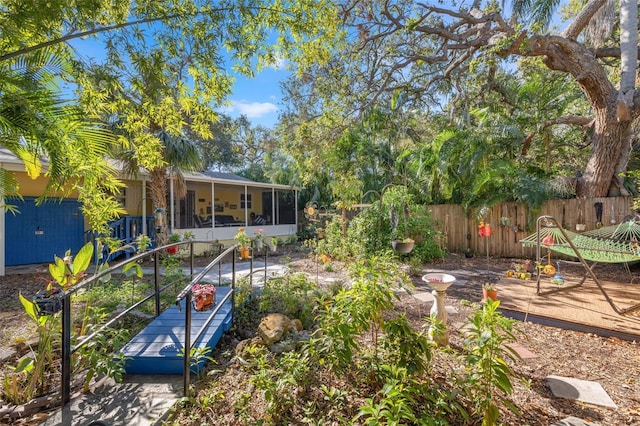 view of yard featuring a sunroom