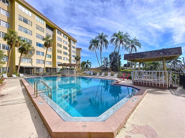 view of swimming pool featuring a patio area