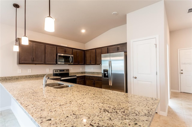 kitchen with kitchen peninsula, stainless steel appliances, sink, hanging light fixtures, and lofted ceiling