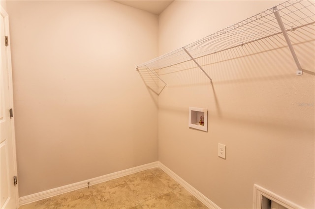 447 Reading St, Lehigh Acres, FL 33974 - laundry area featuring washer hookup and baseboards