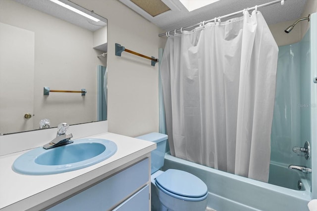 full bathroom featuring vanity, toilet, a textured ceiling, and shower / tub combo