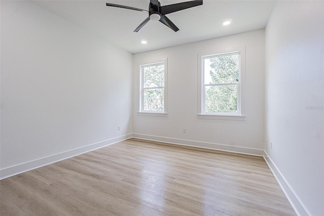 empty room with light wood-style floors, recessed lighting, ceiling fan, and baseboards