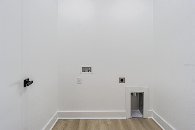 laundry room with laundry area, baseboards, hookup for a washing machine, hookup for an electric dryer, and light wood-style floors