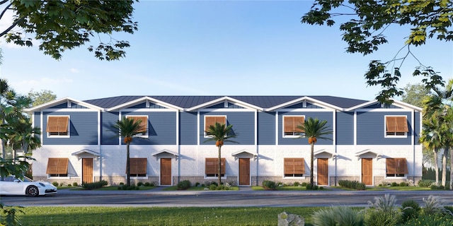 13750 Park Blvd Unit 2, Seminole, FL 33776 - view of property with stone siding and metal roof