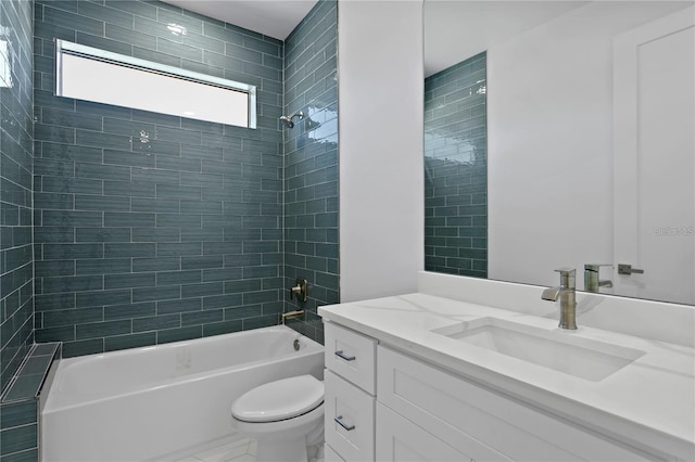 full bathroom with tiled shower / bath combo, toilet, and vanity