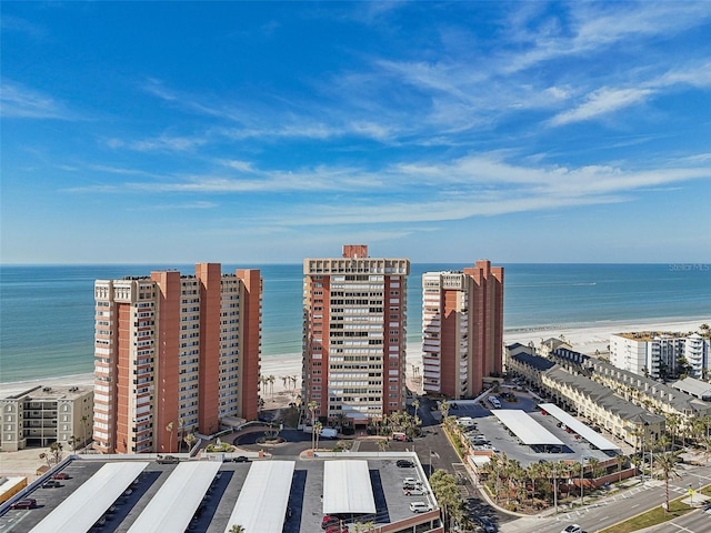 drone / aerial view with a water view and a view of the beach