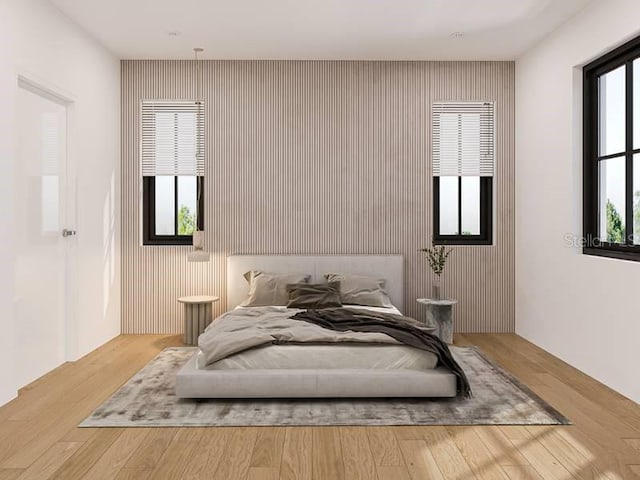 bedroom with hardwood / wood-style floors