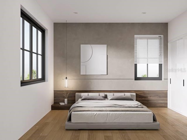 bedroom featuring hardwood / wood-style flooring