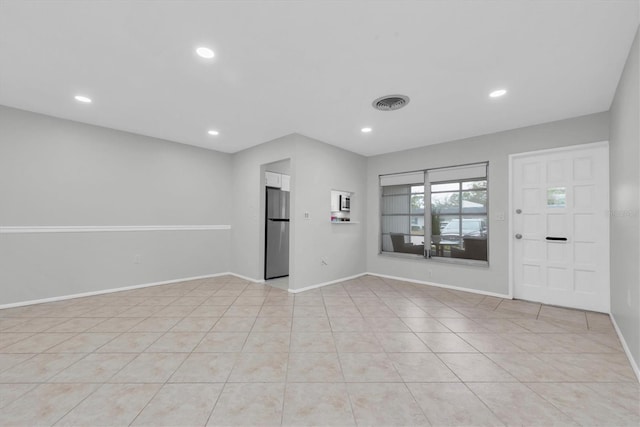 interior space featuring light tile patterned floors