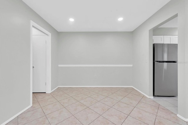 empty room with light tile patterned flooring