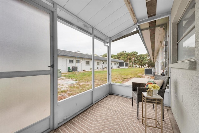 sunroom / solarium with vaulted ceiling