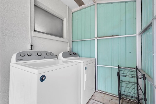 washroom featuring washing machine and dryer