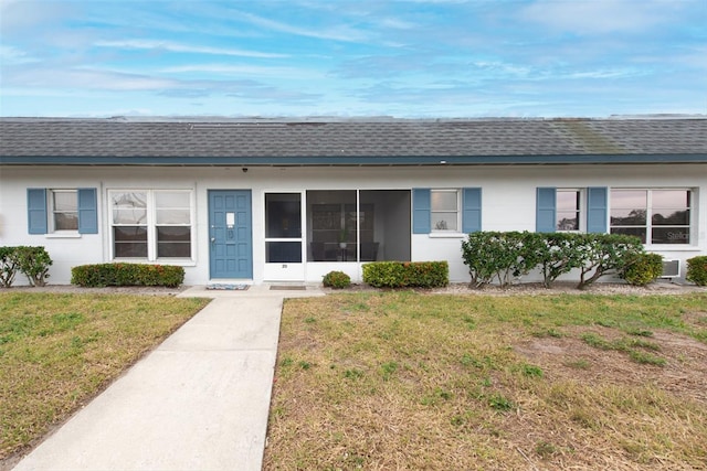 ranch-style home with a front yard